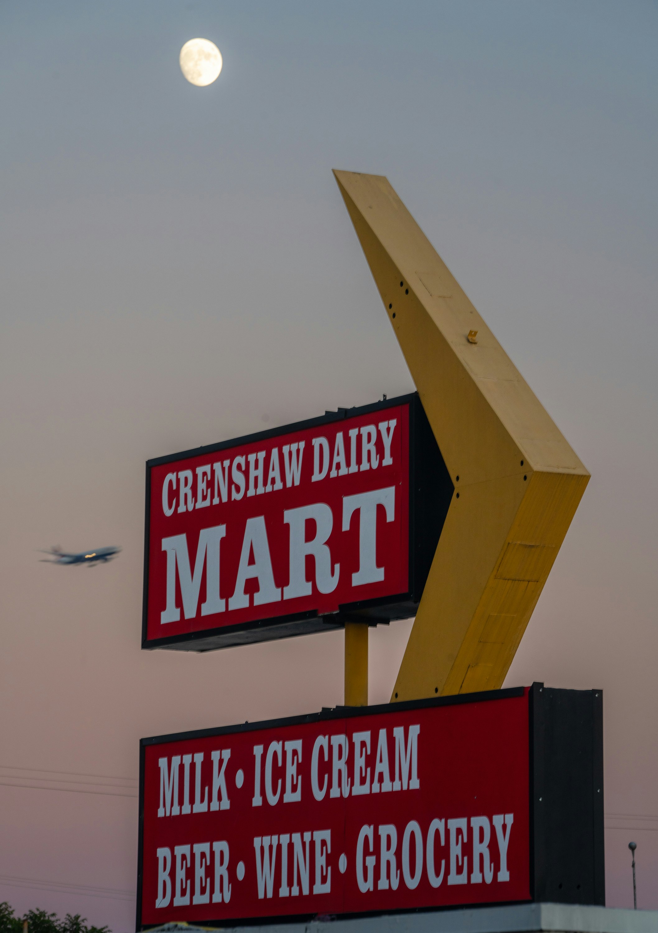 Crenshaw Dairy Mart historic landmark and sign at dusk. Photographed by Elon Schoenholz. 2023. Courtesy of the Crenshaw Dairy Mart.
