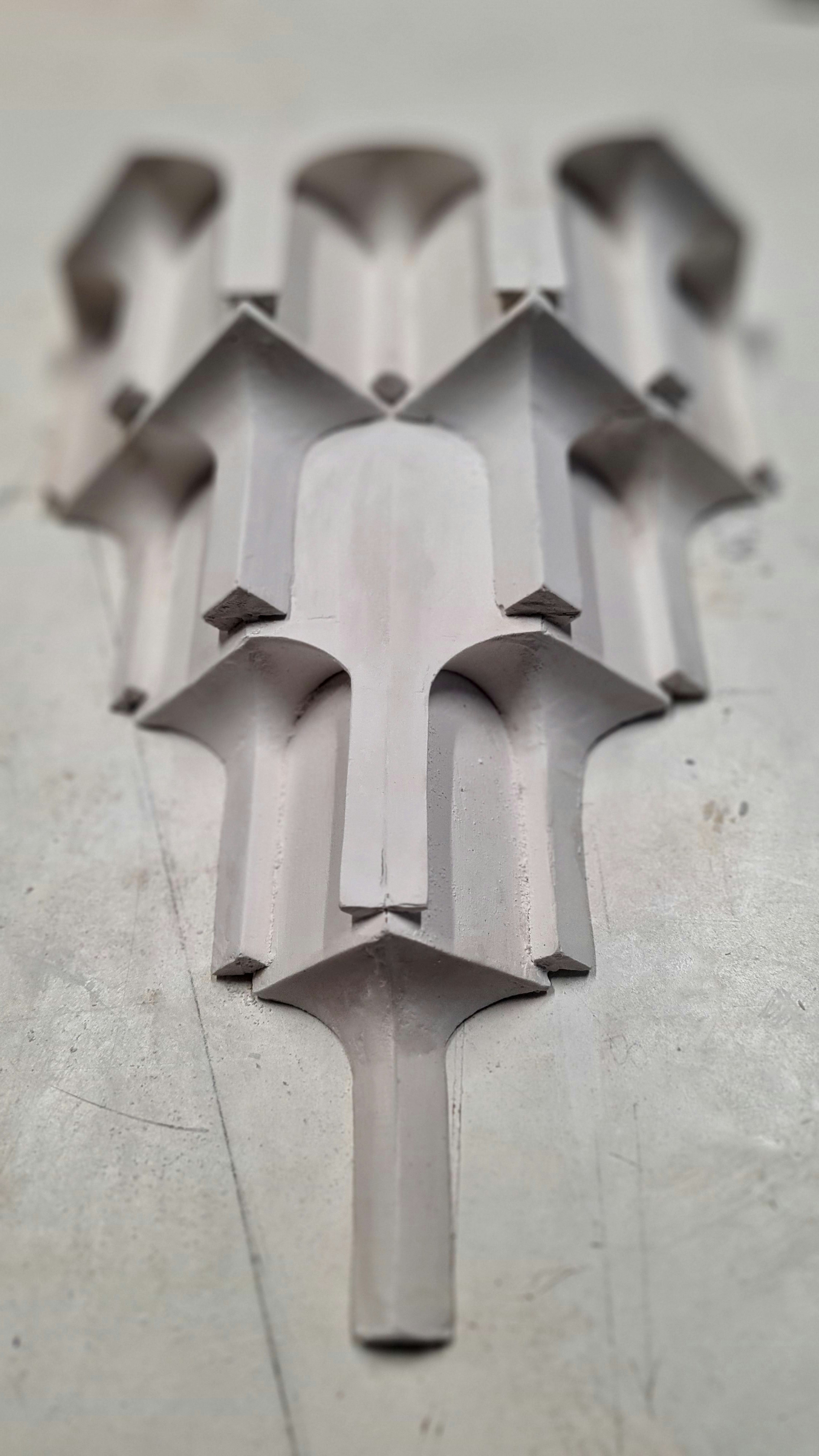 A photograph of a plaster wall moulding made up of geometric shapes.